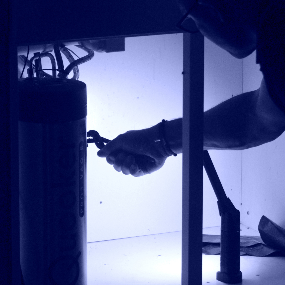 Plumber installing hot water tank